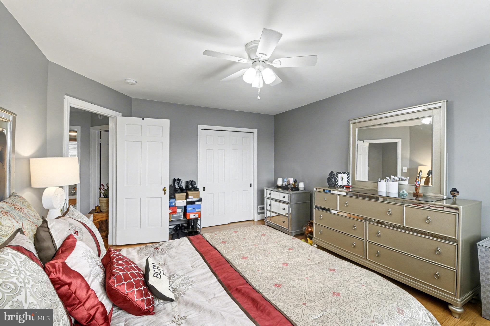 1510 Medford Road Baltimore, MD 21218 - Photo 15 of 30 a very nice looking bedroom with a large bed and a chandelier