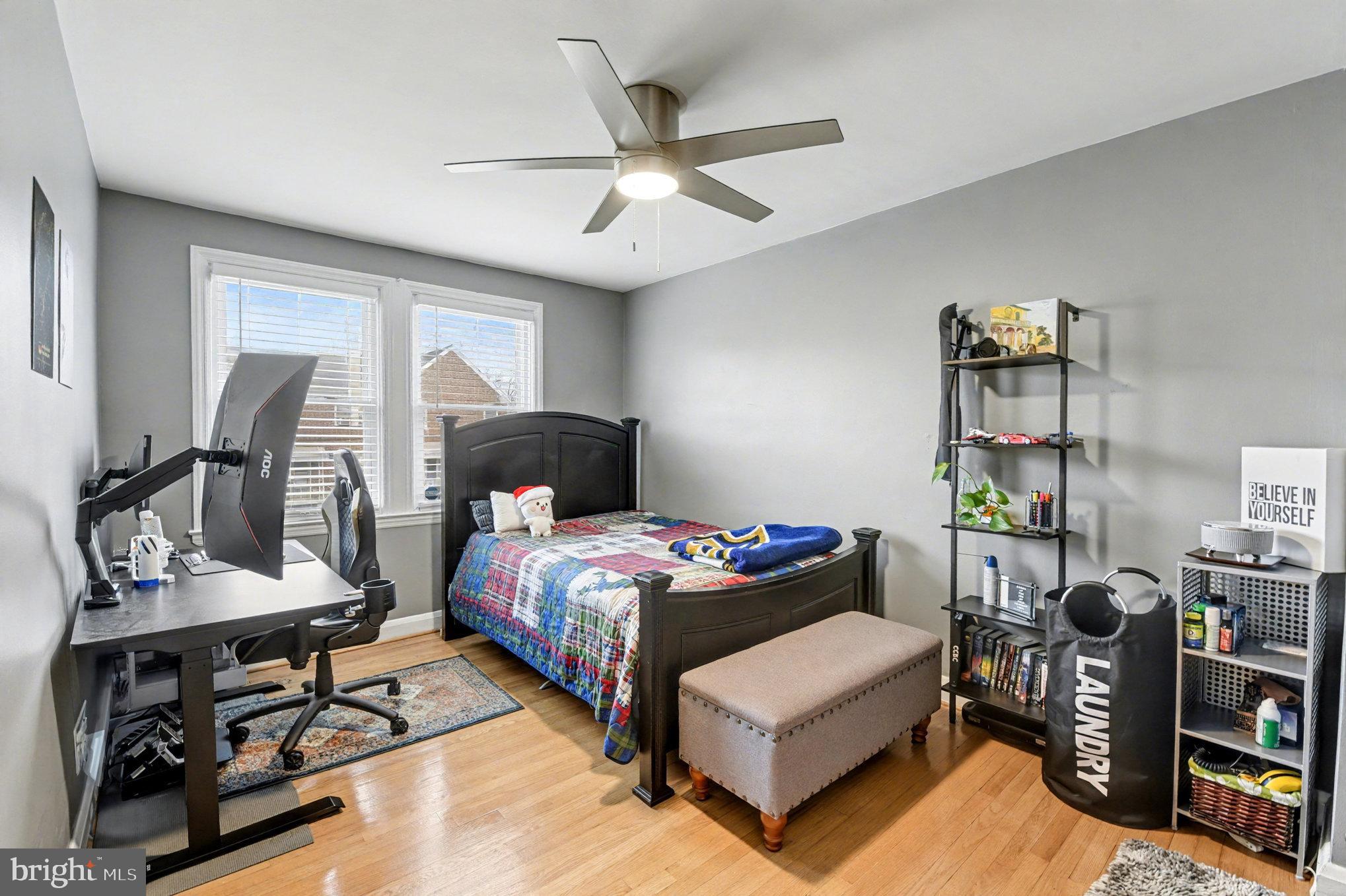 1510 Medford Road Baltimore, MD 21218 - Photo 16 of 30 a bedroom with bed and a chandelier
