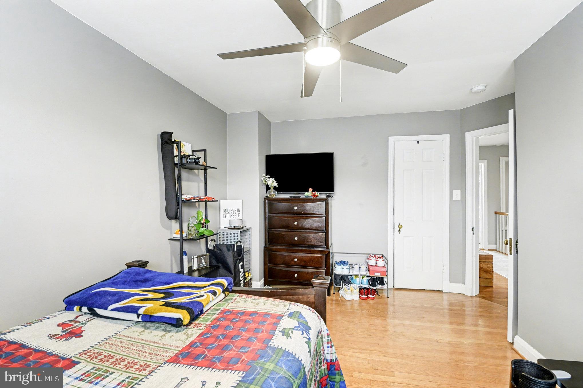 1510 Medford Road Baltimore, MD 21218 - Photo 17 of 30 a bedroom with bed and a flat tv screen