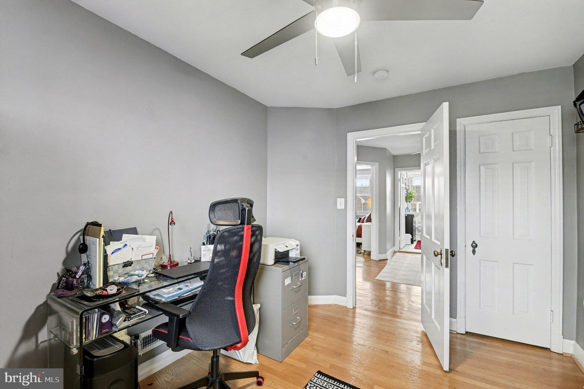 1510 Medford Road Baltimore, MD 21218 - Photo 18 of 30 a view of a workspace with furniture and wooden floor