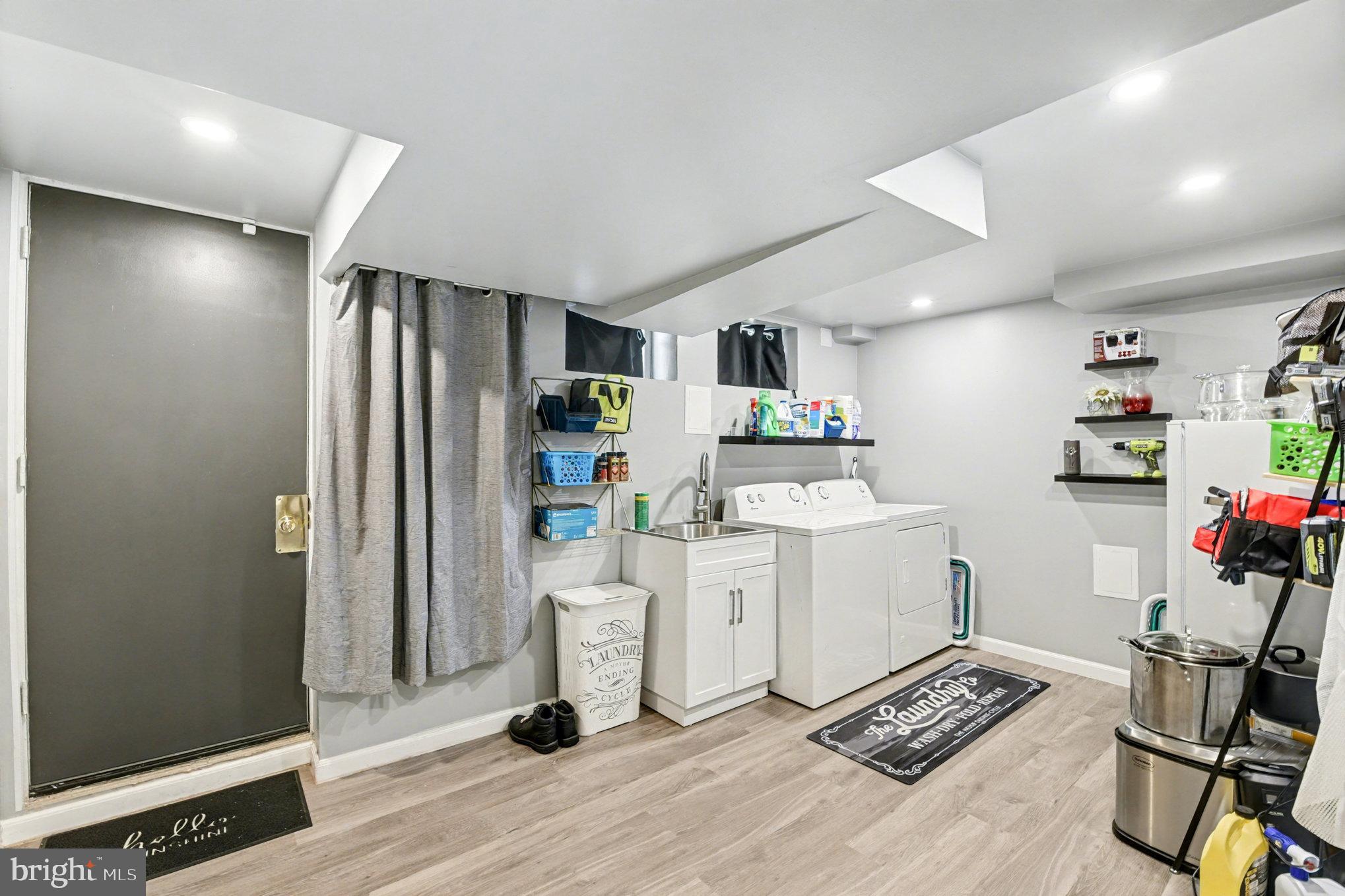 1510 Medford Road Baltimore, MD 21218 - Photo 24 of 30 a kitchen with a refrigerator and a stove top oven