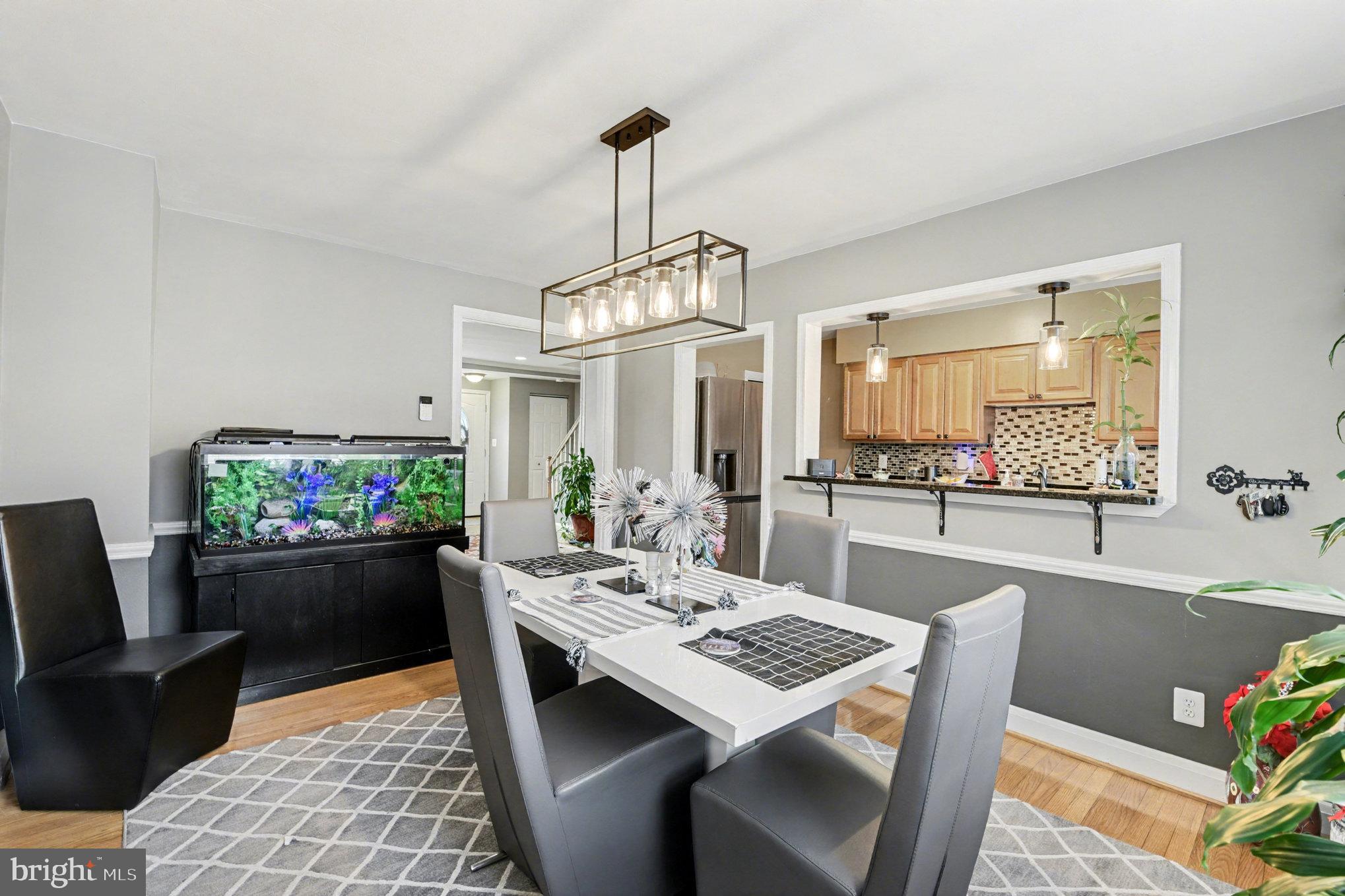 1510 Medford Road Baltimore, MD 21218 - Photo 8 of 30 a view of a dining room with furniture window and wooden floor