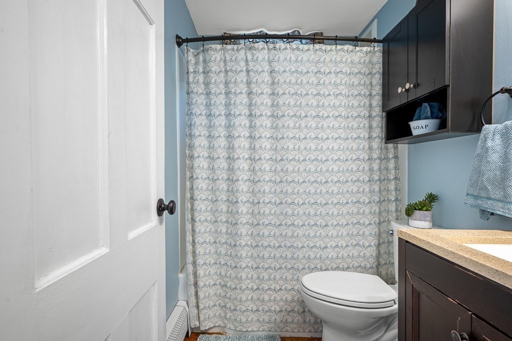 5 Colonial Drive Leicester, MA 01611 - Photo 12 of 24 a bathroom with a sink a toilet and shower curtain