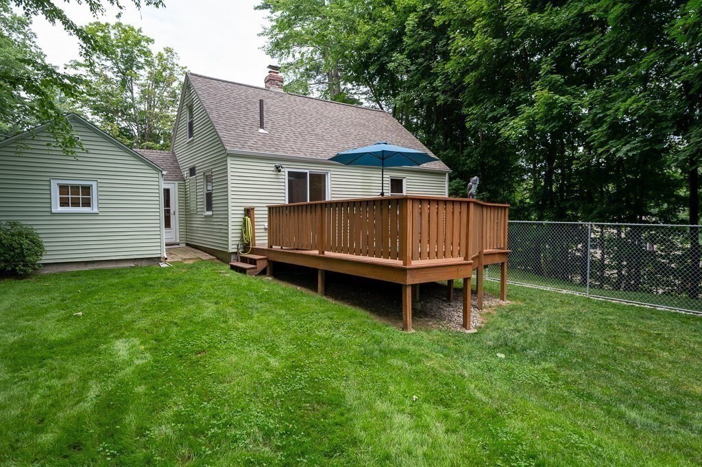 5 Colonial Drive Leicester, MA 01611 - Photo 21 of 24 a view of a house with a yard and sitting area