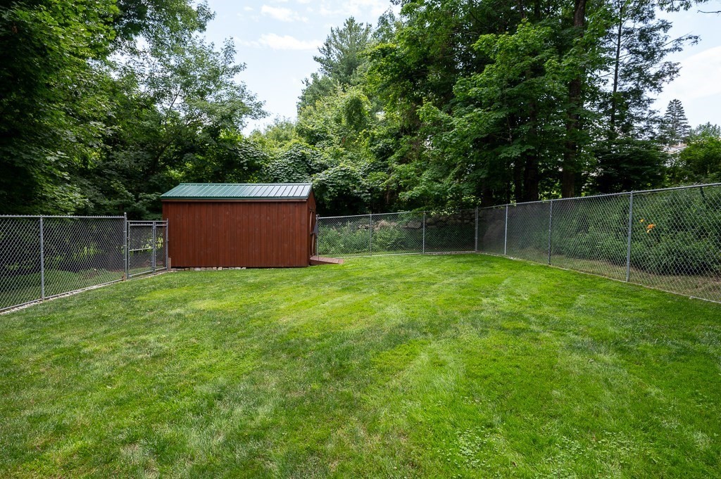 5 Colonial Drive Leicester, MA 01611 - Photo 22 of 24 a backyard of a house with lots of green space