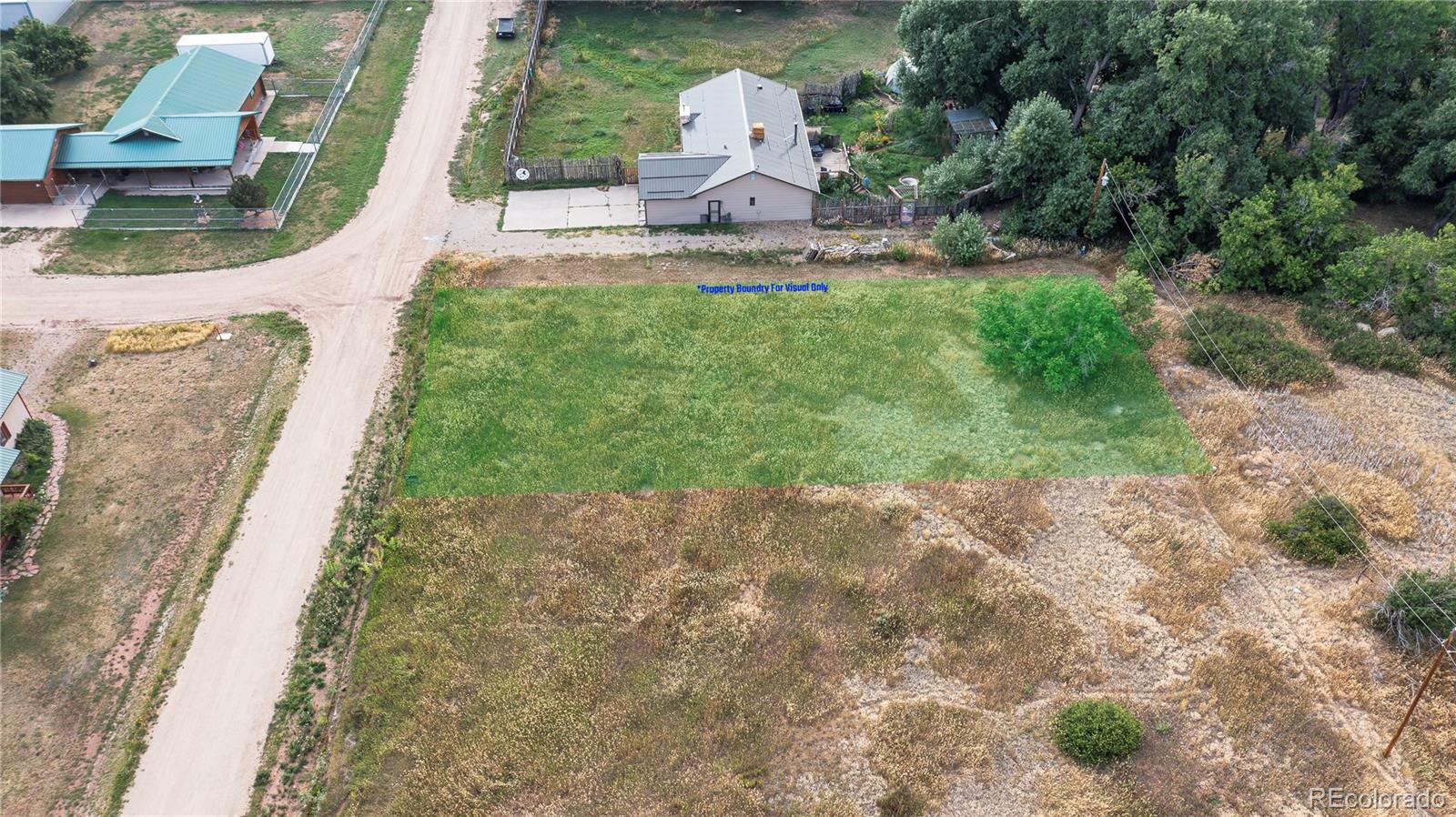 High Street La Veta, CO 81055 - Photo 13 of 17 a front view of a house with a yard and pathway