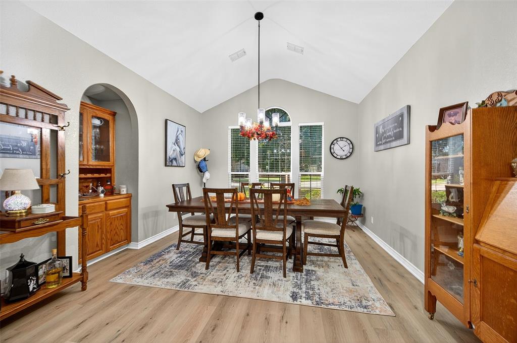 202 Hillside Lindsay, TX 76250 - Photo 13 of 37 a dining room with furniture window entryway and wooden floor