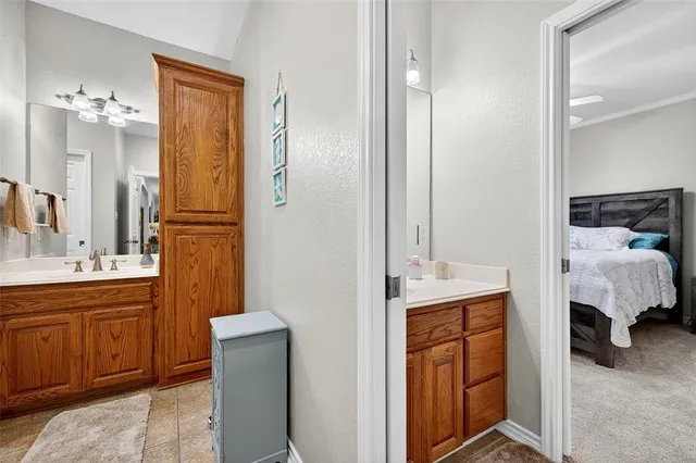 a en suite bathroom with a sink double vanity