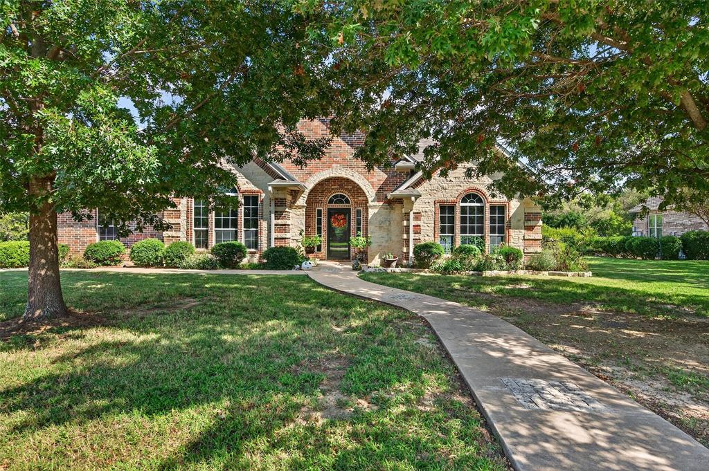 202 Hillside Lindsay, TX 76250 - Photo 2 of 37 a front view of a house with yard and green space