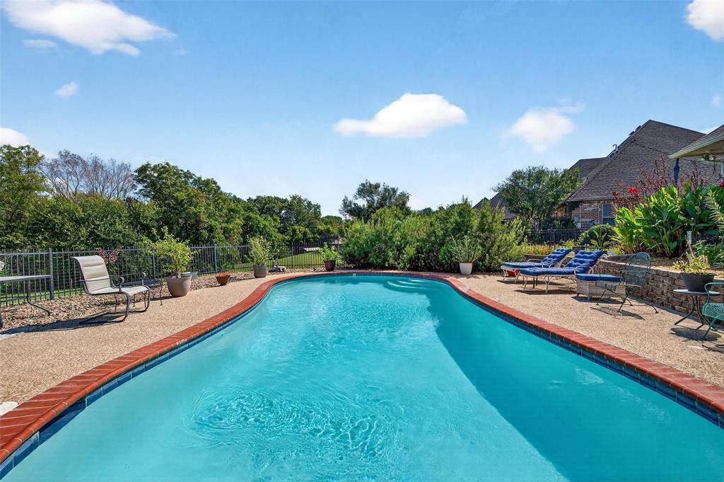 202 Hillside Lindsay, TX 76250 - Photo 27 of 37 a view of a swimming pool with lounge chair