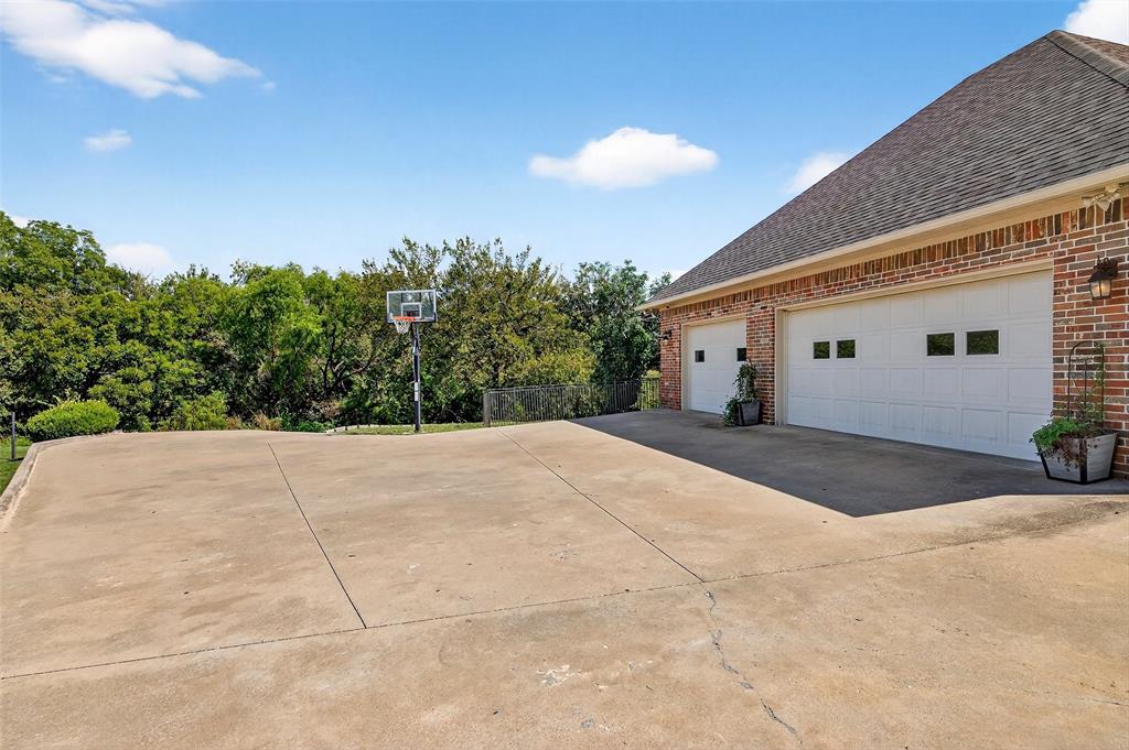 202 Hillside Lindsay, TX 76250 - Photo 31 of 37 a view of a white house with a yard and potted plants