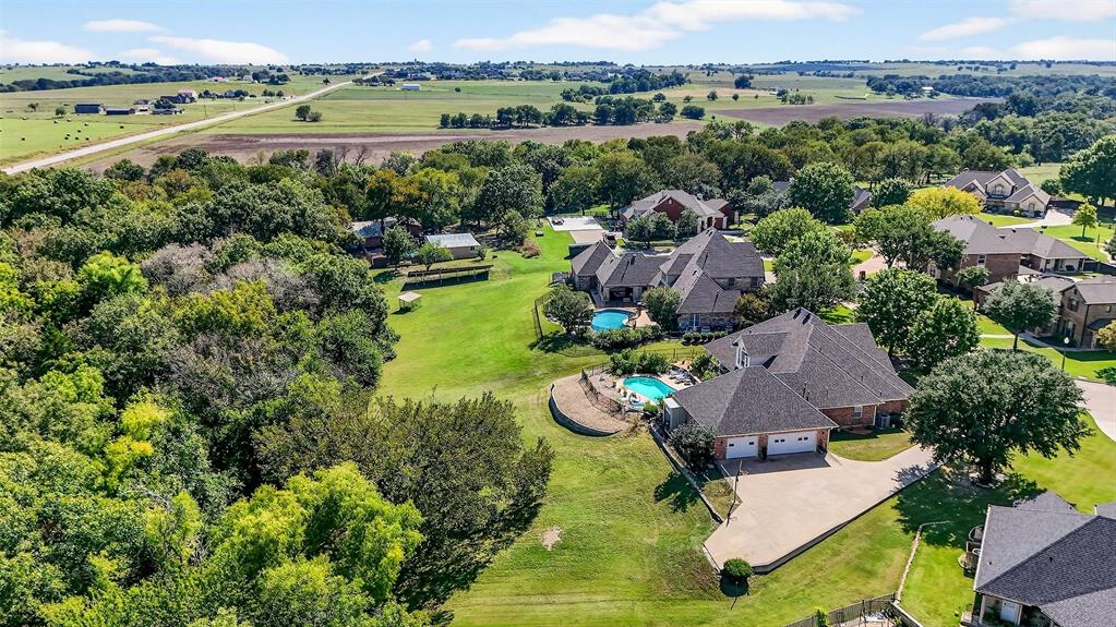 202 Hillside Lindsay, TX 76250 - Photo 34 of 37 an aerial view of a house with a garden and lake view