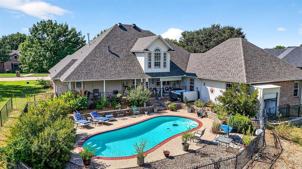 202 Hillside Lindsay, TX 76250 - Photo 37 of 37 a front view of a house with swimming pool and chairs