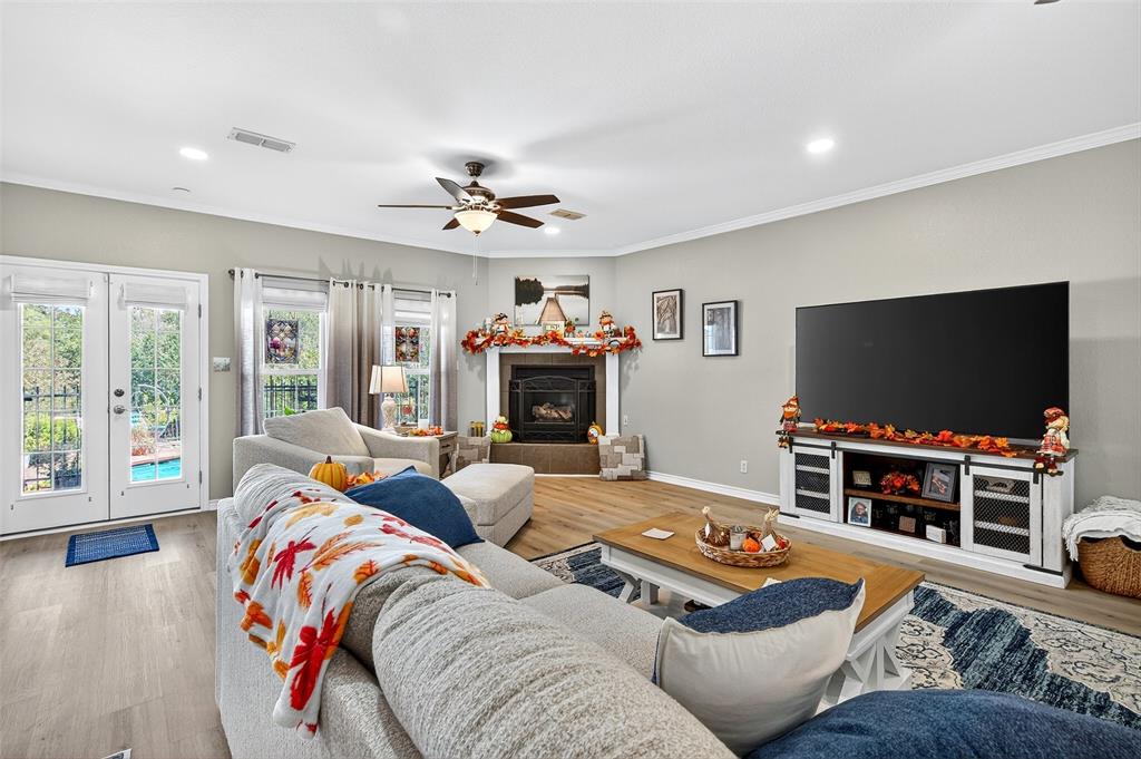 202 Hillside Lindsay, TX 76250 - Photo 6 of 37 a living room with furniture and a flat screen tv
