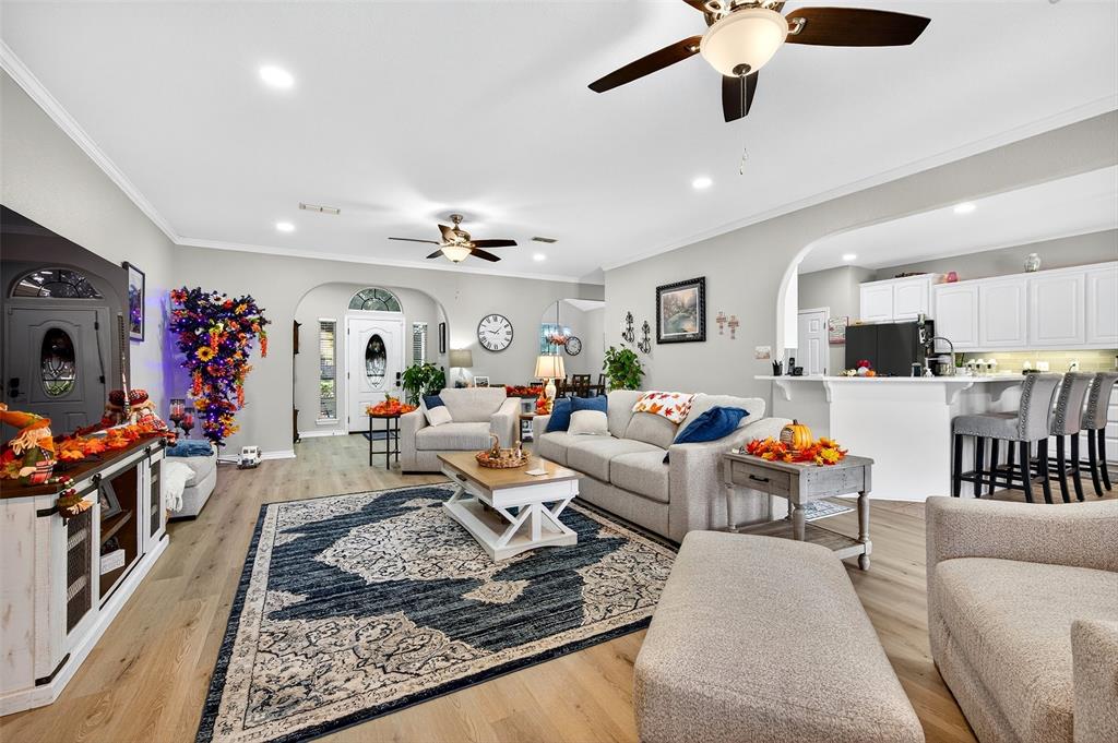 202 Hillside Lindsay, TX 76250 - Photo 8 of 37 a living room with furniture kitchen view and a chandelier