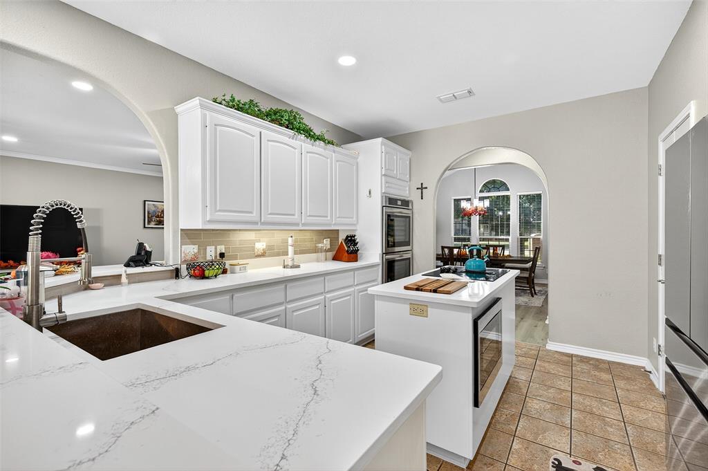 202 Hillside Lindsay, TX 76250 - Photo 10 of 37 a kitchen that has a sink and a stove in it