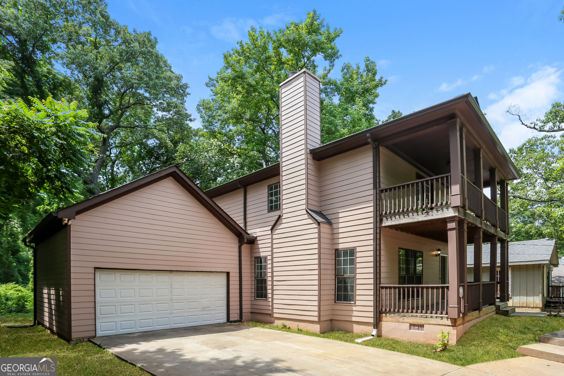 2041 Pryor Road Southwest Atlanta, GA 30315 - Photo 1 of 17 a view of a house with a yard and potted plants