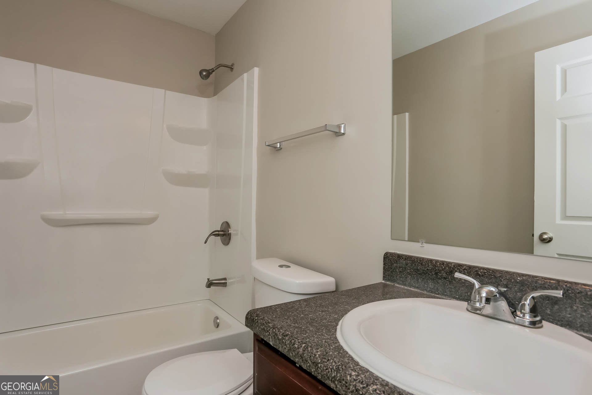 2041 Pryor Road Southwest Atlanta, GA 30315 - Photo 14 of 17 a bathroom with a granite countertop sink toilet and shower