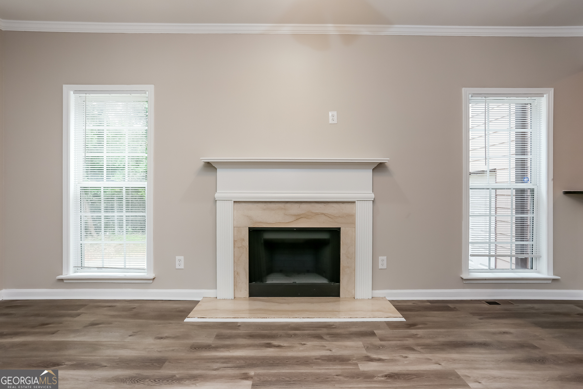 2041 Pryor Road Southwest Atlanta, GA 30315 - Photo 3 of 17 a living room with a fireplace and a window