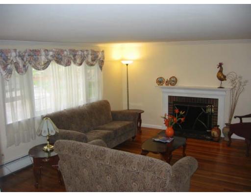 6 Brabrook Road Acton, MA 01720 - Photo 5 of 14 a living room with furniture and a fireplace