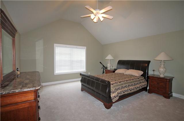 1609 Fair House Road Spring Hill, TN 37174 - Photo 14 of 20 a bedroom with a bed dresser and a window