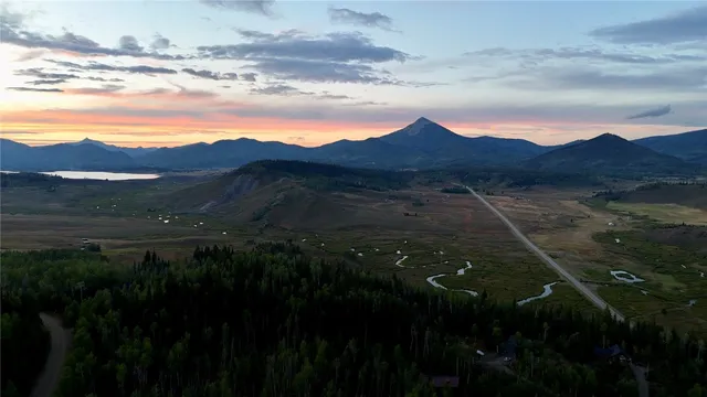 a view of an aerial view of residential house and yard