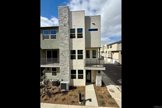 a front view of a building with garden