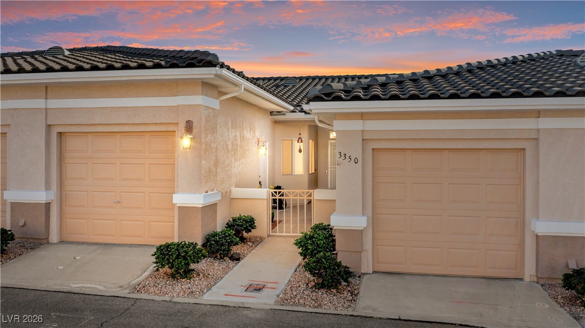 3350 Pheasant Canyon Way, Unit 1008 Laughlin, NV 89029 - Photo 2 of 80 View of front of property with stucco siding and a tiled roof