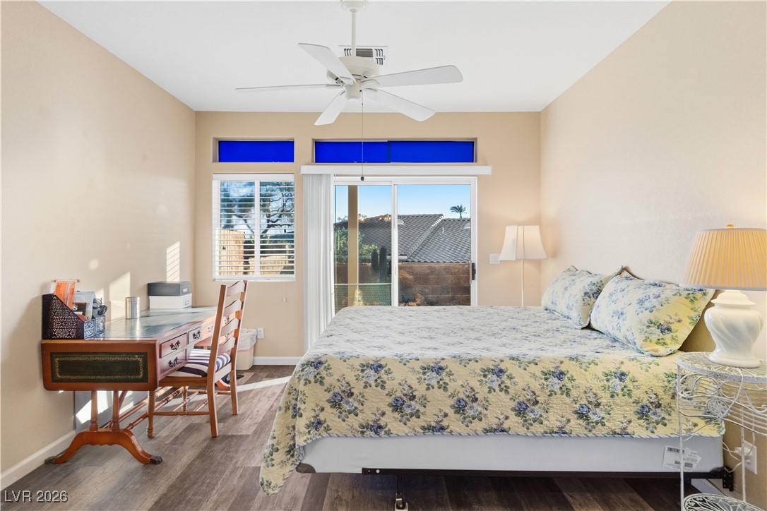 3350 Pheasant Canyon Way, Unit 1008 Laughlin, NV 89029 - Photo 21 of 80 Bedroom with dark wood finished floors, access to outside, and ceiling fan