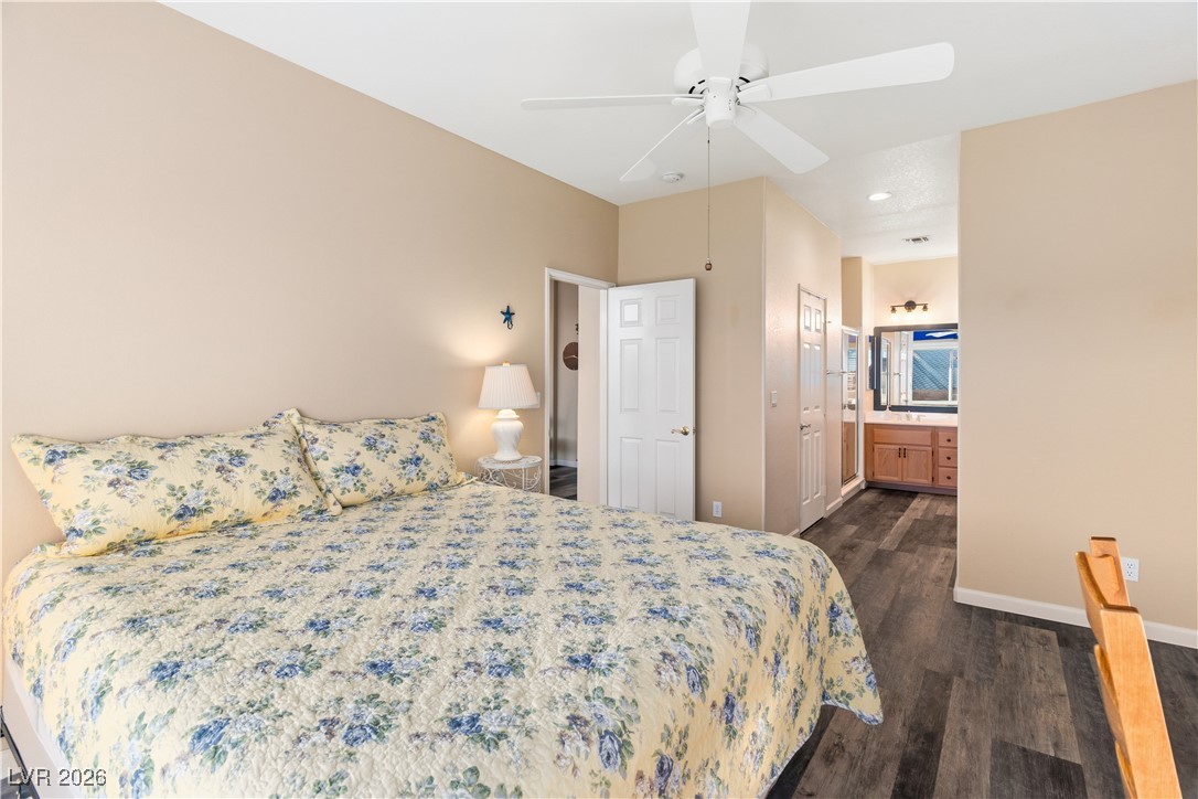 3350 Pheasant Canyon Way, Unit 1008 Laughlin, NV 89029 - Photo 23 of 80 Bedroom with a closet, dark wood-style flooring, a ceiling fan, and ensuite bathroom