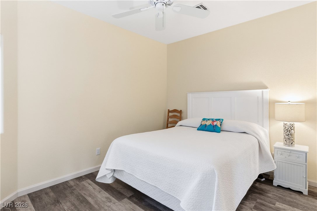 3350 Pheasant Canyon Way, Unit 1008 Laughlin, NV 89029 - Photo 29 of 80 Bedroom featuring dark wood-type flooring and ceiling fan