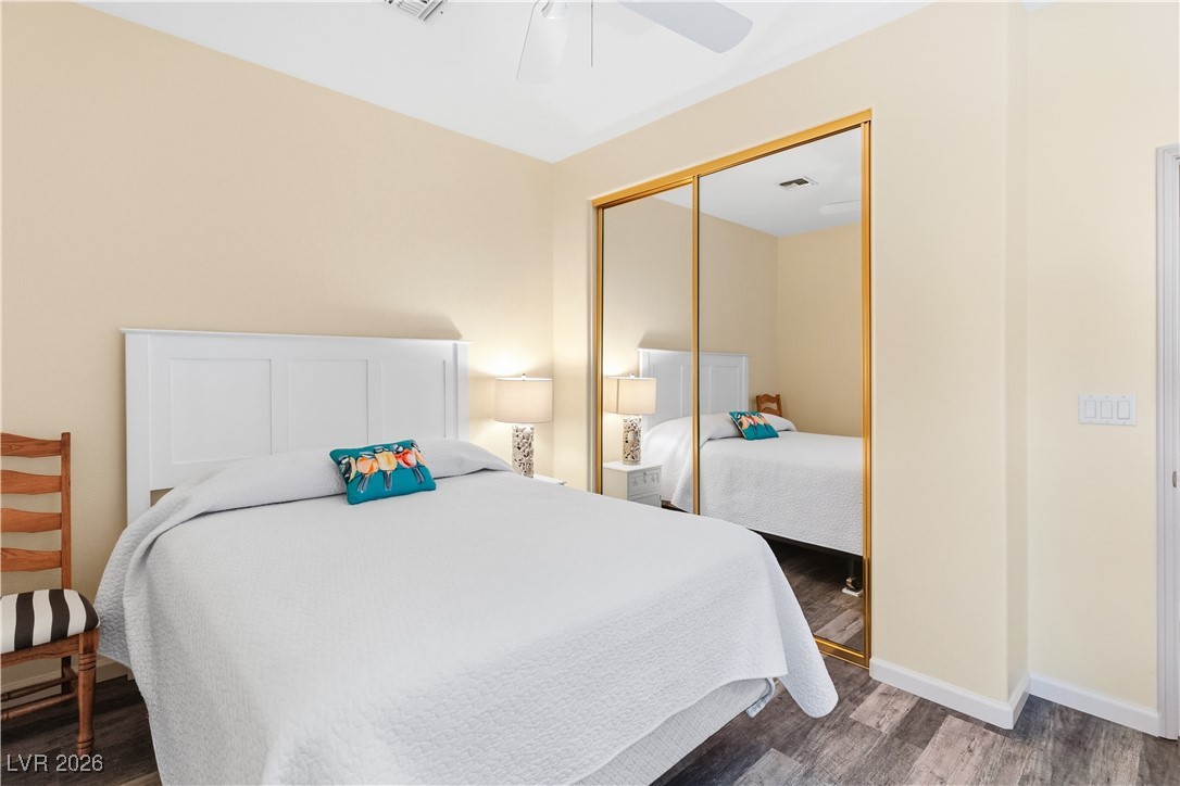 3350 Pheasant Canyon Way, Unit 1008 Laughlin, NV 89029 - Photo 30 of 80 Bedroom with dark wood-style floors, a ceiling fan, and a closet