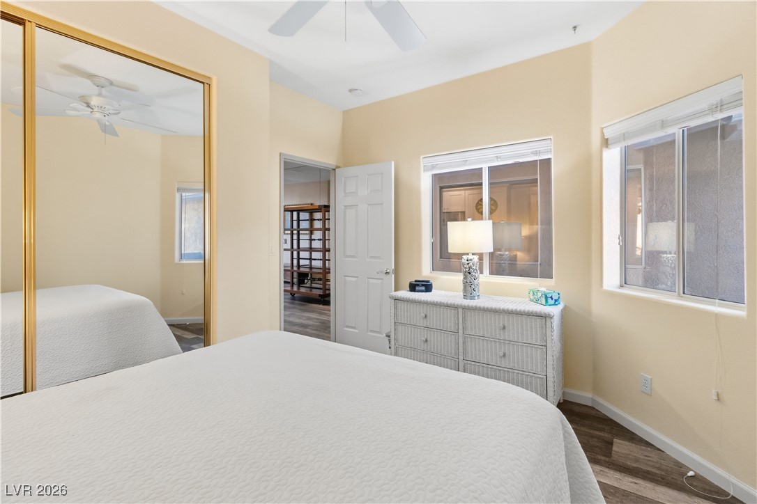 3350 Pheasant Canyon Way, Unit 1008 Laughlin, NV 89029 - Photo 31 of 80 Bedroom featuring dark wood-type flooring, a ceiling fan, and a closet