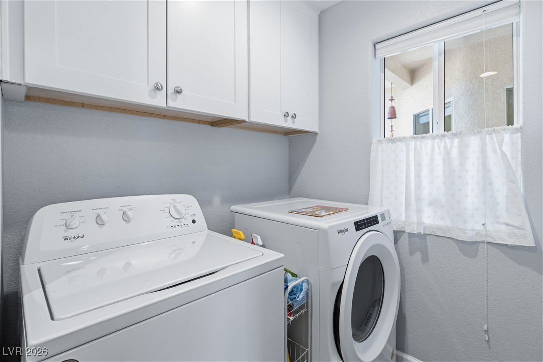 3350 Pheasant Canyon Way, Unit 1008 Laughlin, NV 89029 - Photo 33 of 80 Laundry area with separate washer and dryer and cabinet space
