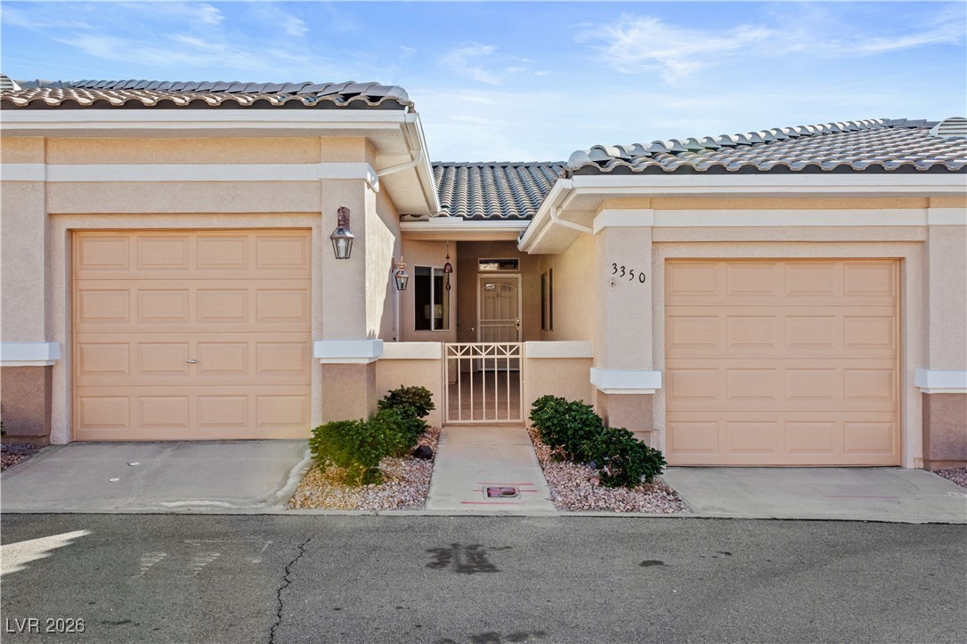 3350 Pheasant Canyon Way, Unit 1008 Laughlin, NV 89029 - Photo 53 of 80 View of front facade with a tiled roof and stucco siding