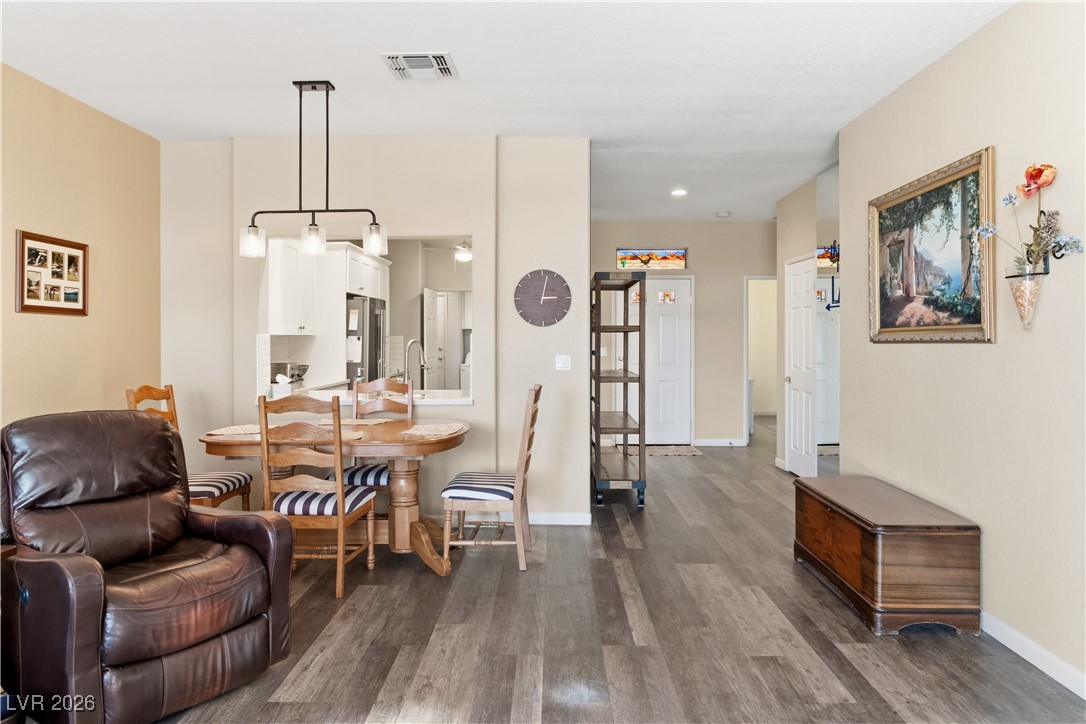 3350 Pheasant Canyon Way, Unit 1008 Laughlin, NV 89029 - Photo 7 of 80 Dining room featuring dark wood-style flooring and baseboards