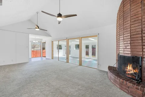 a living room with furniture fireplace and flat screen tv