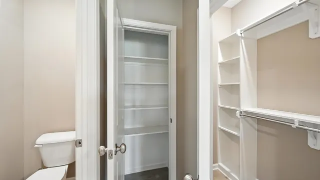 a bathroom with a toilet and a sink