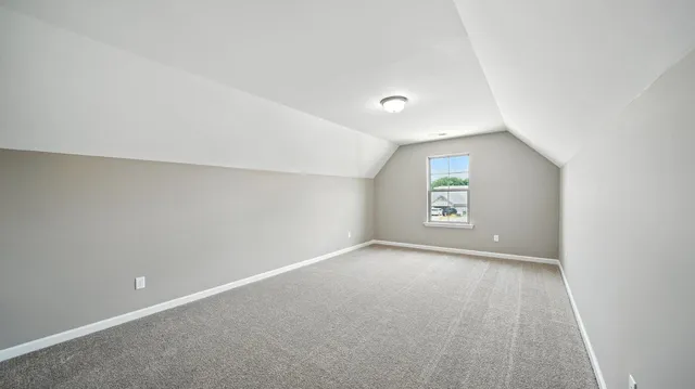 an empty room with a empty space and windows