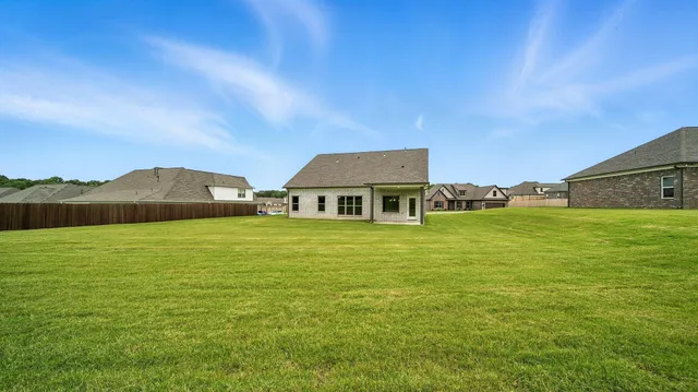 a view of a house with a big yard