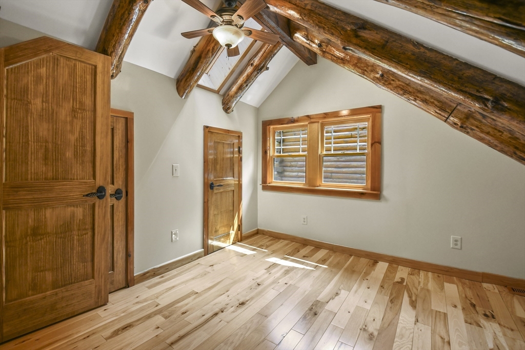 389 Kelly Road Northbridge, MA 01534 - Photo 28 of 40 a view of an empty room with wooden floor and a window