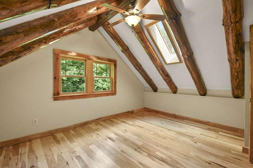 389 Kelly Road Northbridge, MA 01534 - Photo 30 of 40 a view of an empty room with wooden floor and a window