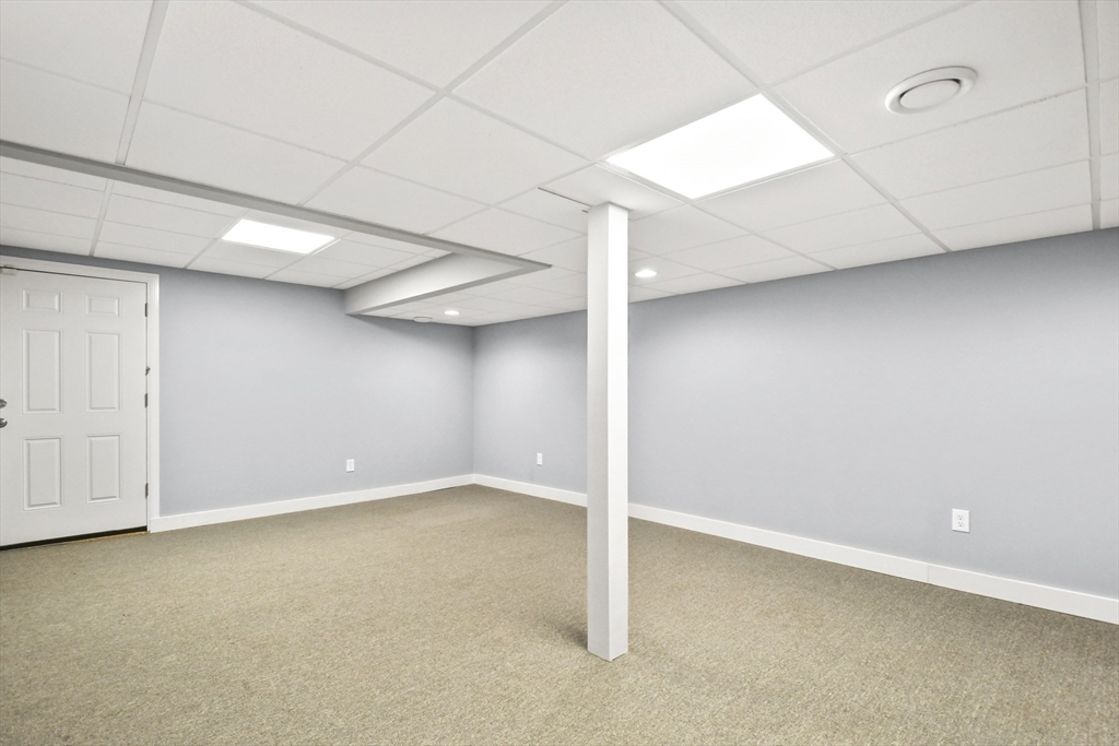 389 Kelly Road Northbridge, MA 01534 - Photo 33 of 40 an empty room with a natural light