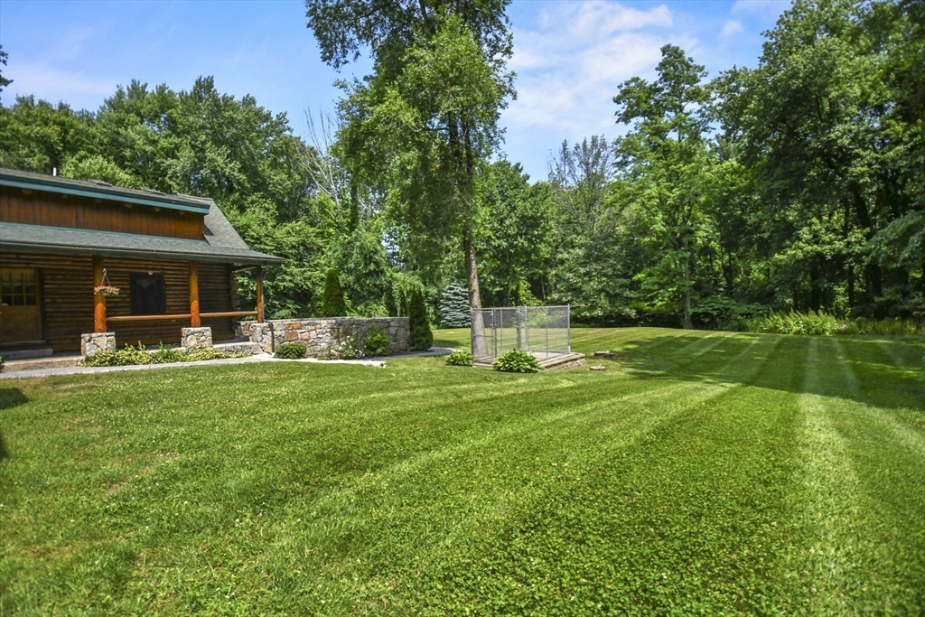 389 Kelly Road Northbridge, MA 01534 - Photo 34 of 40 a view of a house with backyard and a slide