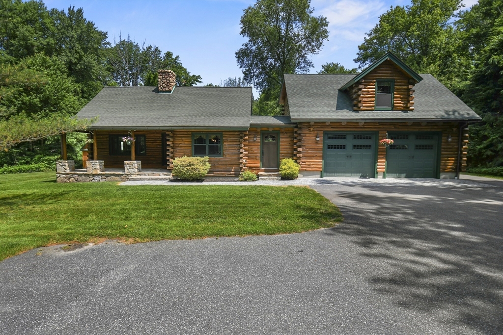389 Kelly Road Northbridge, MA 01534 - Photo 4 of 40 a front view of a house with garden and trees