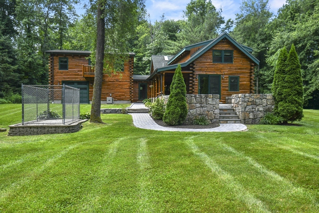 389 Kelly Road Northbridge, MA 01534 - Photo 5 of 40 a front view of a house with a yard