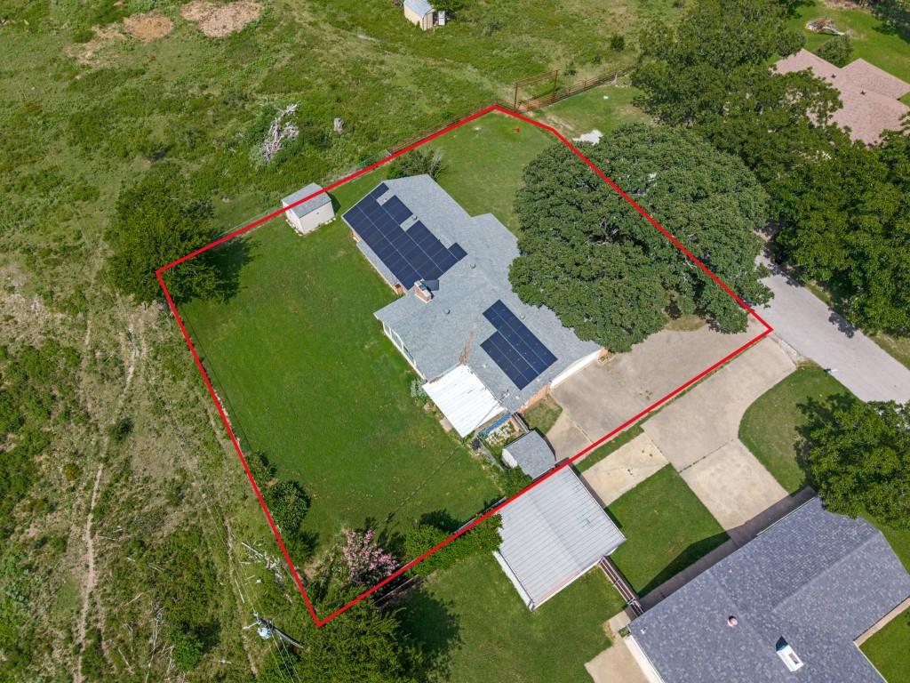 1081 Wright Street Terrell, TX 75160 - Photo 3 of 29 Aerial perspective highlighting land boundaries of a residential property with an expansive green lawn
