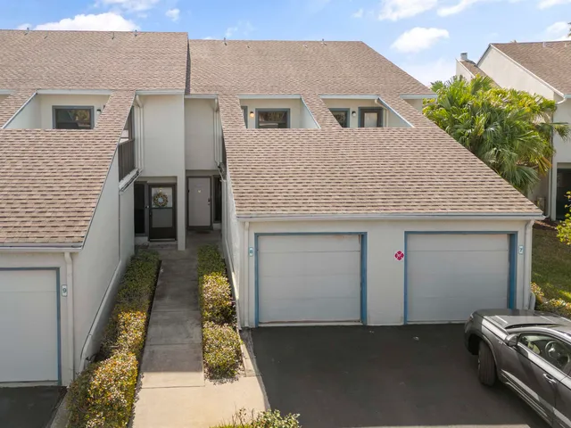 a front view of a house with a garage