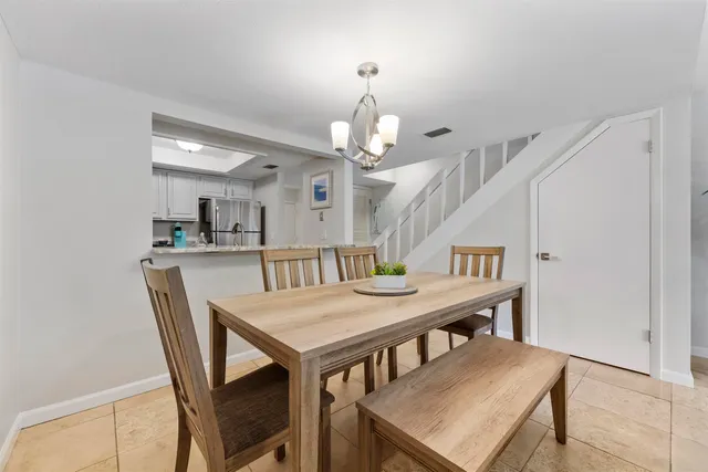 a kitchen with stainless steel appliances granite countertop a refrigerator and cabinets