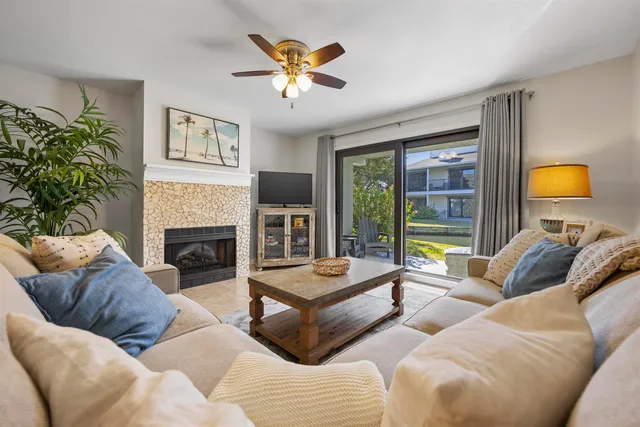 a view of a patio with table and chairs and potted plants